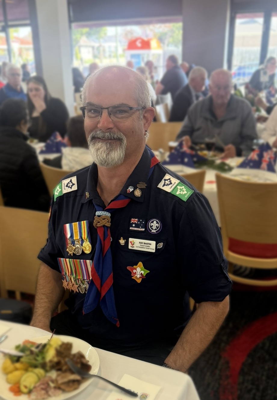 Ray Bastin, Group Leader of 1st Deepdene Scouts, in Scout uniform with service medals